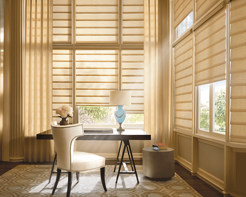 Tan neutral tone roman shades and drapery in elegant home office space