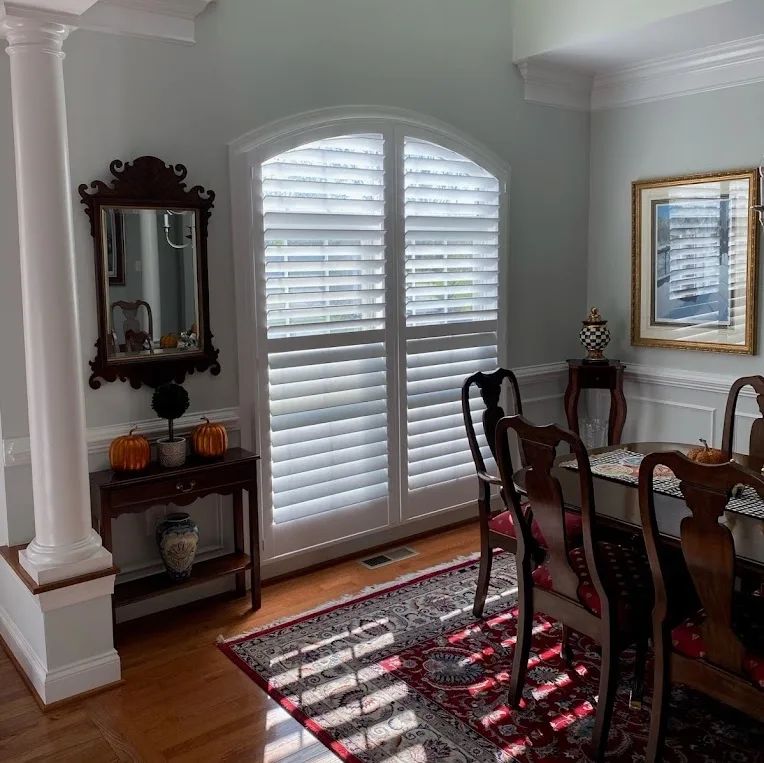 Plantation shutters installed on french doors by the Blind Shade & Shutter Co in Loudoun County, Virginia.