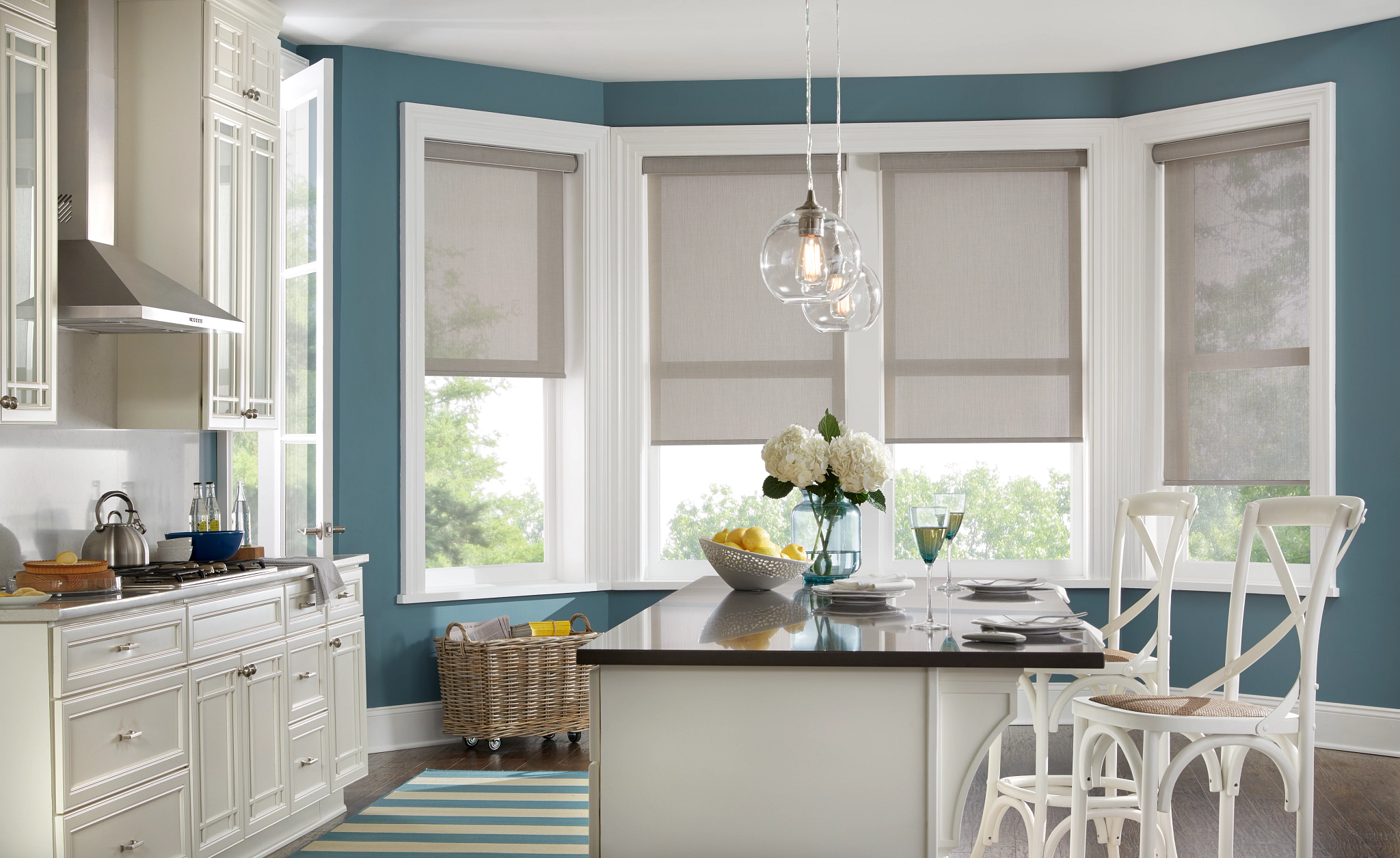 Alta roller shades on bay windows in kitchen.